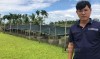 Anh Nguyễn Hữu Nhơn trong trang trại nuôi ốc bươu đen hữu cơ của mình. Ảnh: Bùi Phụ
